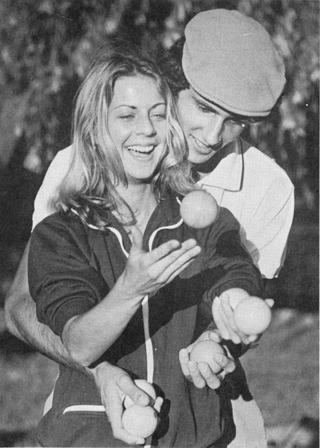 Six balls, four hands.  Bob Giduz gives instruction to Patsy Daniels, reporter for The Charlotte Observer. 