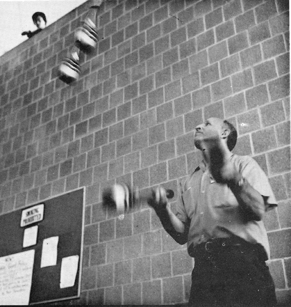 Bill Dietrich from Erie, PA, an original IJA member, commands an overhead audience while juggling four clubs.