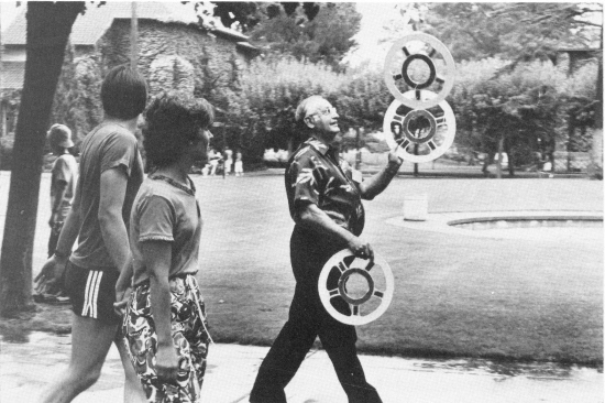 Eddie Johnson, an IJA founder, leads the parade to the street performers 