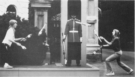 Chin up, old chap! David Aiken and Susan Kirby pass clubs around a guard at the Government House in Ottawa, Canada. (Jean Ringuette photo)