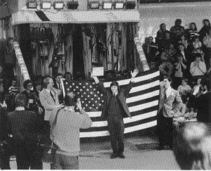 John Foss (l) and Gred Milstein (r) lift the stars & stripes in Latvia for festival director Vitrolds Birkhans (c)