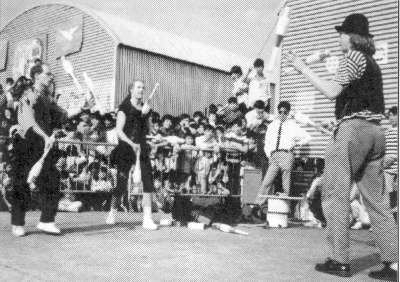 (l-r) Anderson, Bradley and Seglins perform for Vietnamese refugees in a Hong Kong detention camp.