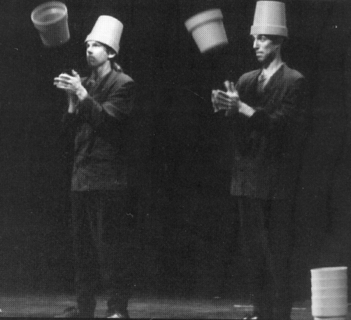 Clockwork (l-r, Rick Rubenstein and Jack Kalvan) don flower pot headgear in their bronze medal Teams Championships act. (David Carper photo)