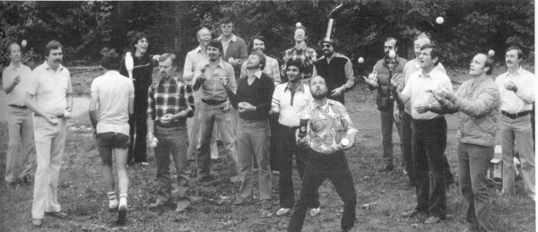 Gelb and Buzan (back left) direct a group of corporate executives in the art of juggling.