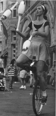 Lisa Polinan, The Unicycle Lady, entertains crowds regularly outside the Old Post Office Building in Washington, DC.