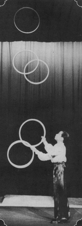 At age 11 in 1944, Bramson juggles five hoops in performance in Copenhagen.