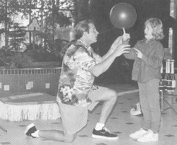 (Right middle) Bobby Besmeth engages a young assistant for his mall show.