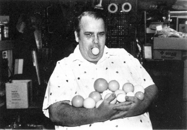 Frank Radtke clowns around in the workshop with the nine different size silicone balls and silicone egg he produces.  Photo by Marion Brown.