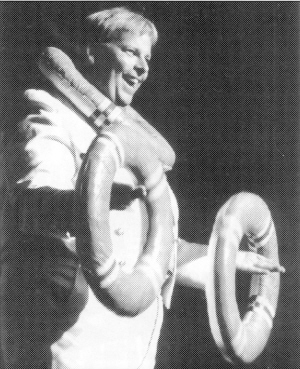 "Admiral" Bob Whitcomb demonstrates life rings for his "passengers".