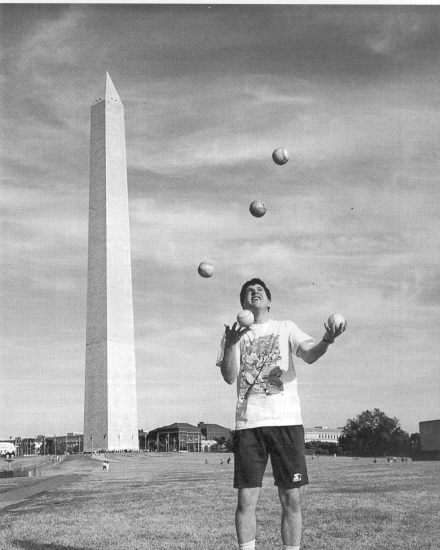 Goldmeier in a more refreshed moment juggling five near the Washington Monument.